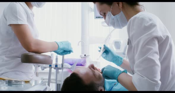 Dental Examination of the Patient's Teeth Using a Camera alt