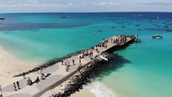 Aerial footage of the famous pier at Cape Verde Capo Verde, showing the fishermen