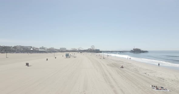 Tropical weather has many outside at the beach to enjoy the day alt