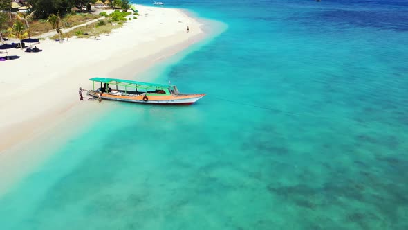 Aerial above texture of tranquil coast beach trip by blue lagoon with white sand background of a day alt