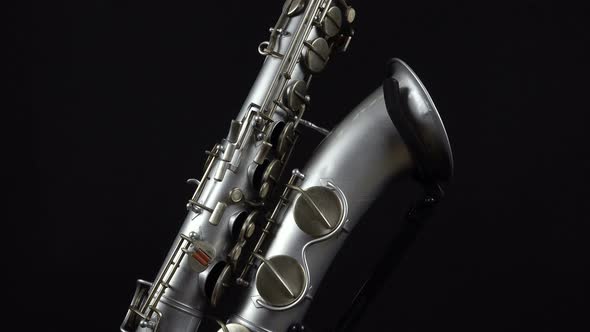 Wind Instrument Saxophone On A Black Background