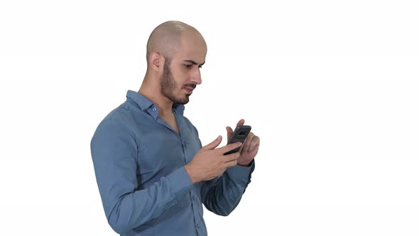 Casual arabic businessman using the phone and smiling on alt