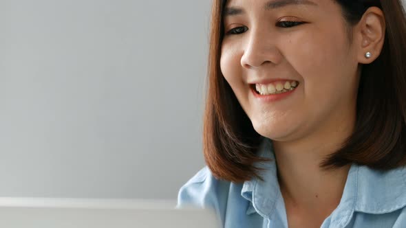 Close up smiling businesswoman owners using laptop at the home office.