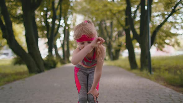 Tired Athletic Fitness Sport Runner Child Girl Taking Break After Jogging Training Finishing Race alt