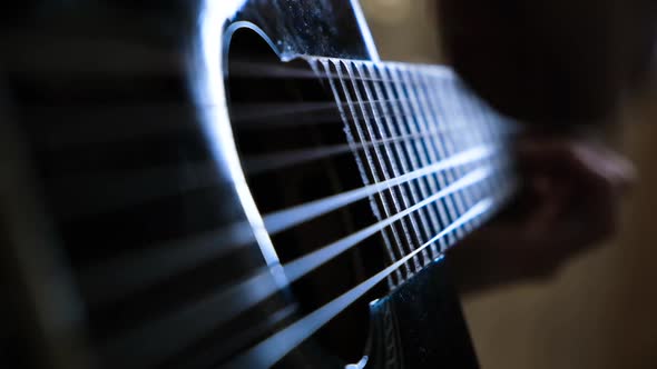 Man playing acoustic guitar alt