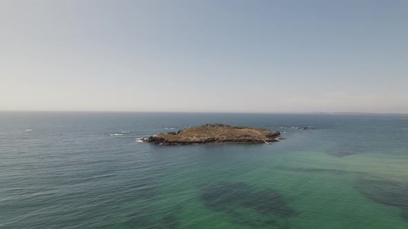 Fort of Pessegueiro Island in Porto Covo Portugal, orbital drone shot seascape