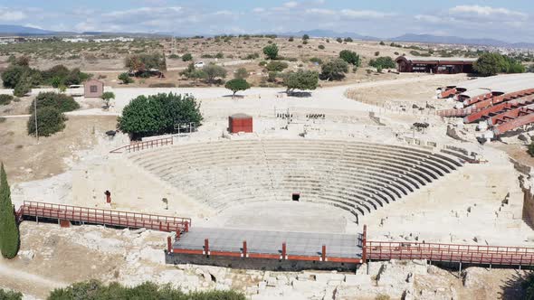 Flight of a Drone Over the Ruins of an Old Historic Ancient Amphitheater alt