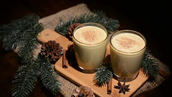 Homemade traditional Christmas eggnog drinks in the glasses