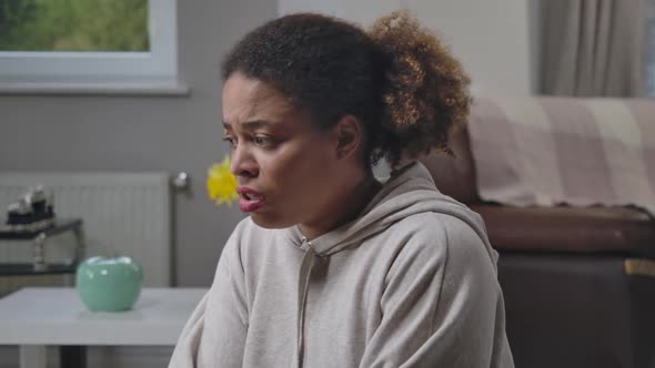 Anxious Sick African American Woman Looking Around with Scared Facial Expression Screaming alt