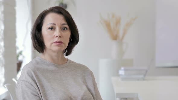 Portrait of Serious Old Senior Woman Looking at Camera alt