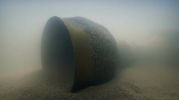 Ancient Gold Chalice In The Sand Underwater alt