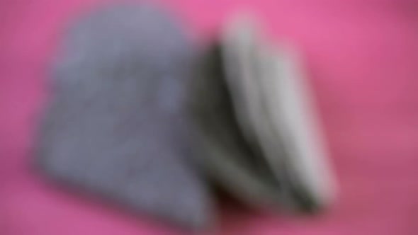 Blue corn taco shells on a pink background. alt
