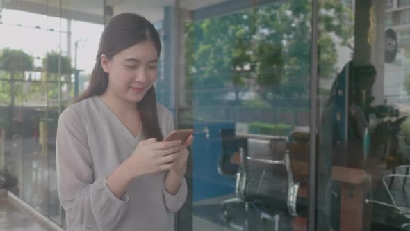 young Asian women walking for work at co-working space modern office alt