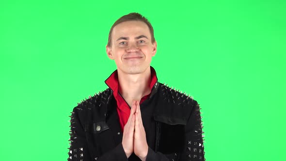 Guy Keeps Palm Together and Asks for Something . Green Screen alt