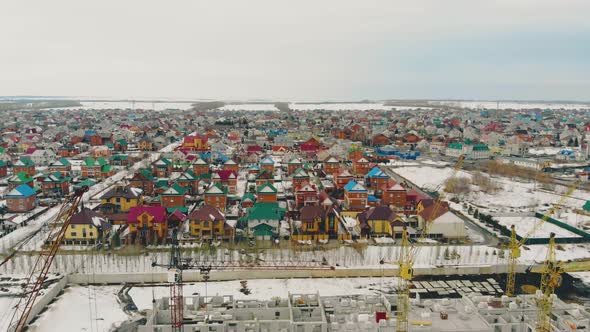 Flight Over Cottage Complex By Ongoing Building Site alt