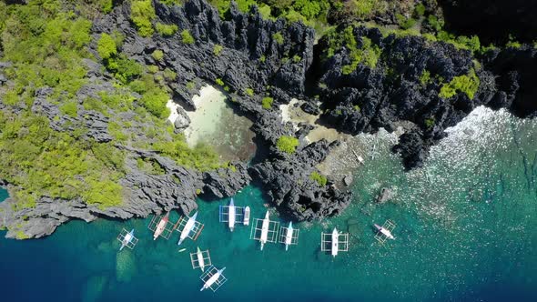 Aerial view of Hidden lagoon, with many spider boats parked, Coron, Palawan, Philippines alt