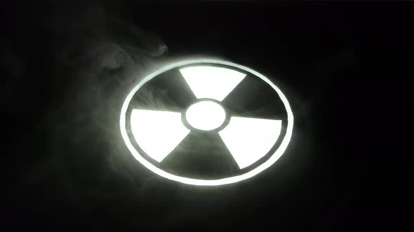 Radiation hazard sign in smoke.