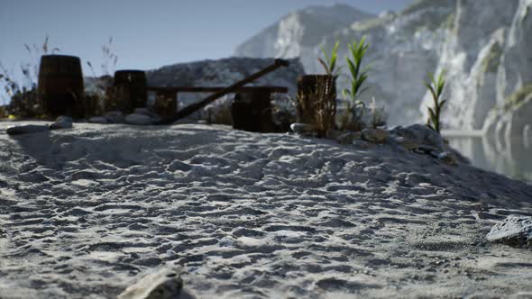 Wooden Barrels with Sea Fish at the Sand Beach alt