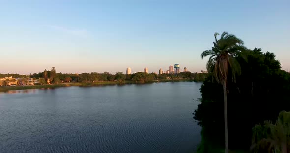 4K Aerial Video of Crescent Lake, Water Tower Rising to See St Petersburg, Florida Skyline alt