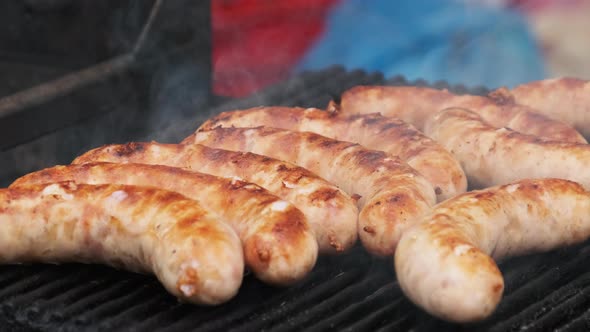 Sausages Prepared on the Grill at Street Food Market. Street Kitchen alt