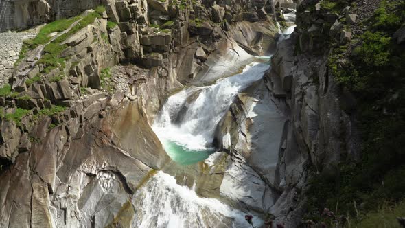 Footage of a stormy mountain river, alps alt