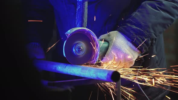 Professional Male Worker Works in Production with Metal alt