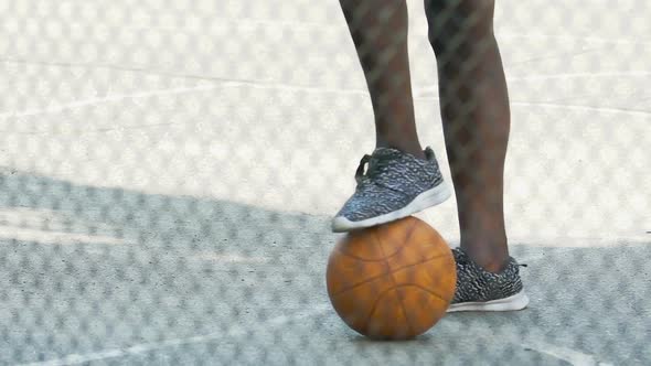 African American Guy in Sneakers Waiting for Team Gathering to Play Basketball alt
