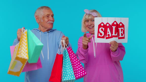 Senior Grandparents Hold Shopping Bags Sale Inscription Banner Text Advertising Price Discounts alt