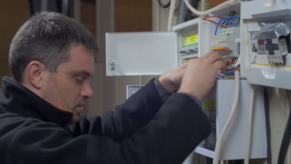 Electrician repairing fuses alt