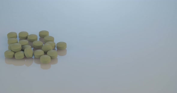 Prescription drugs - Capsules, pills, tablets on reflective background alt