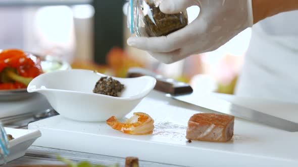 Spoon Lays Mixture in Bowl. alt