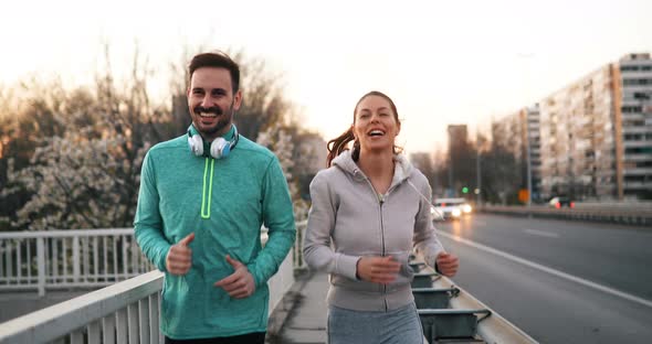 Happy Friends and Sports People Jogging and Running Outdoor