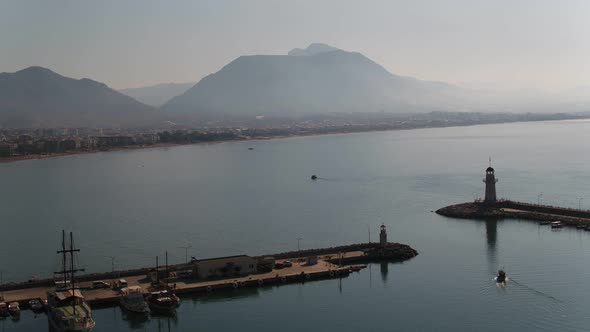 Sea Lighthouse Ships And Mountains Aerial View alt