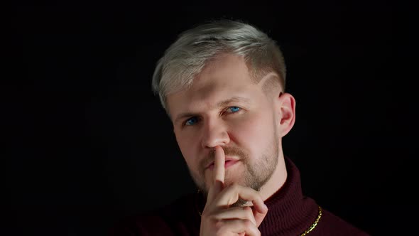 Strict Serious Man Asking to Stay Calm Keep Silence or Secrecy with Finger on Lips Shh Gesture alt