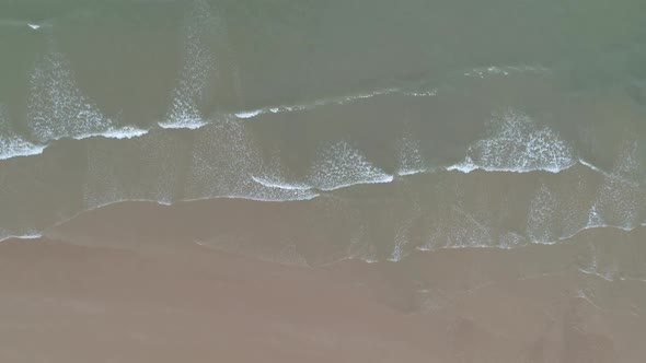 Scenic aerial drone topdown view of Omaha Beach landing area in Colleville sur Mer, Normandy, France alt