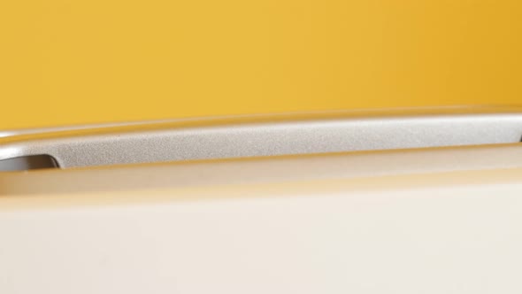 Toasting white bread inside two-slot automatic electric toaster 4K footage alt