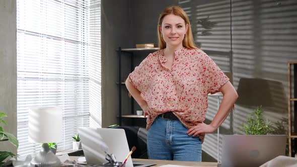Portrait of Attractive Happy Female Creative Clothing Designer Standing in Modern Office alt