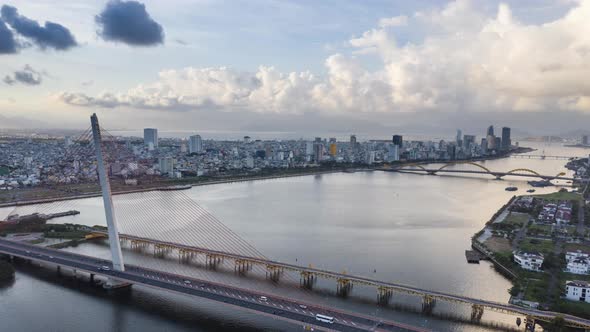 A hyperlapse aerial drone shot over Danang city river. alt