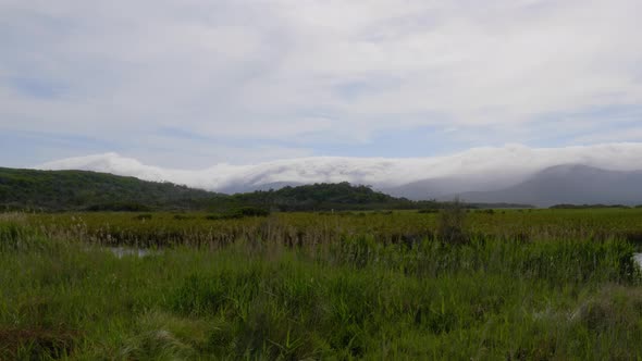 A landscape shot of clouds covering the mountains near Darby river in Wilsons Promontory National pa alt