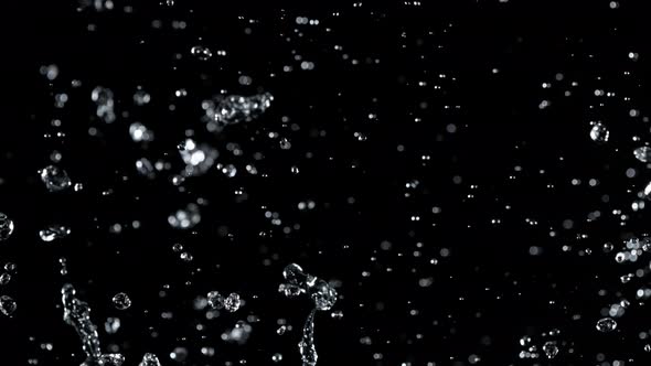 Super Slow Motion Shot of Water Splash Isolated on Black Background at 1000Fps alt