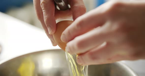 Person Opening the Egg with the Knife