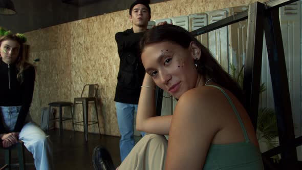 Stylish Teenagers Posing in Sports Room Showing the Colorful Make Up alt