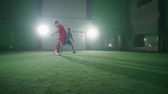 Slow Motion Training Day on the Football Club Young Guys Play Football Indoor Stadium Man Bypass the alt