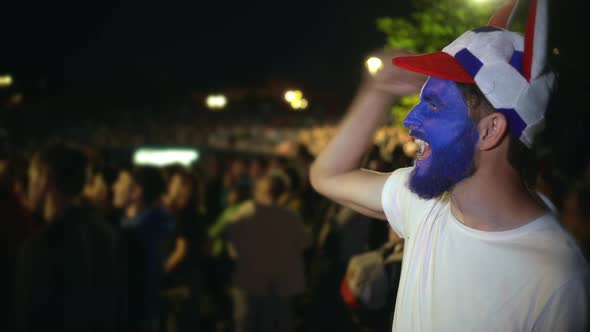 Closeup Guy Scream Furiously, Jump Friend Backdrop Crowd From Win. Soccer Fan alt