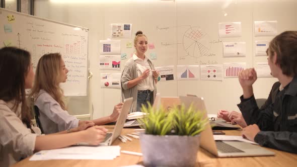 Meeting of multiracial professional teamwork with coworkers at the business office.
