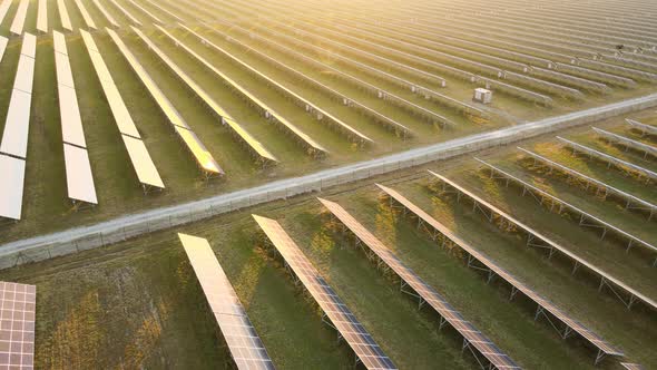 Aerial View of Big Sustainable Electric Power Plant with Many Rows of Solar Photovoltaic Panels for alt