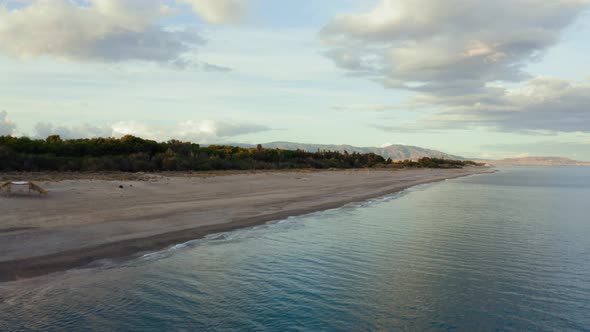 Sandy Coast near the Calm Ocean alt
