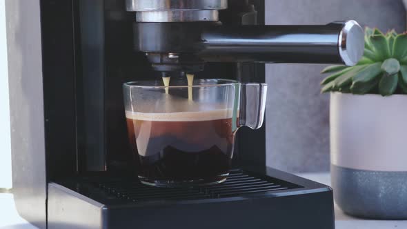 Coffee Machine Making Espresso in Glass Transparent Coffee Cup