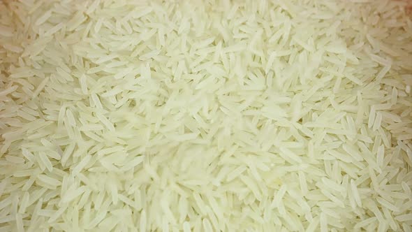 Falling Raw Rice Grains Under Macro.