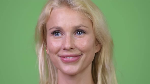 Head Shot of Happy Young Beautiful Blonde Woman Thinking Shirtless